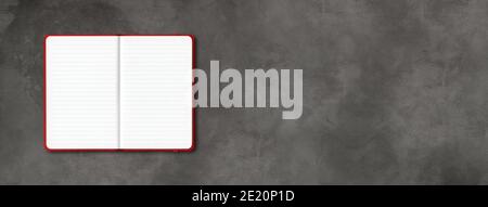 Red open lined notebook mockup isolated on dark concrete background. Horizontal banner Stock Photo