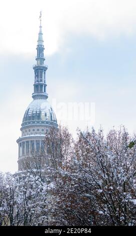 Winter day in Novara, Italy. An unusual snow fall covered the town and the San Gaudenzio dome in white Stock Photo