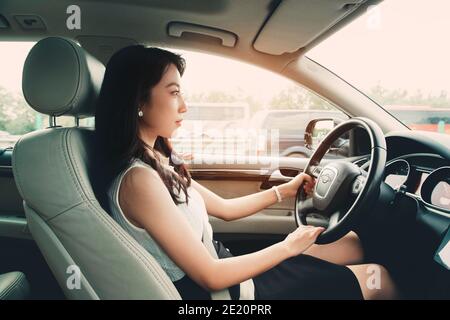 Confident young women to drive Stock Photo