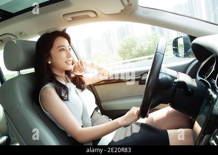 Confident young women to drive Stock Photo