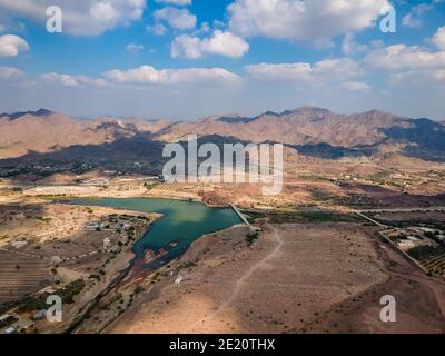 Hatta town aerial cityscape surrounded by Hajar mountains in Hatta ...
