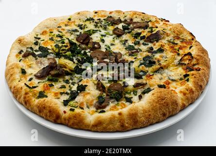 Italian Pizza with potatoes, mushrooms and spinach Stock Photo