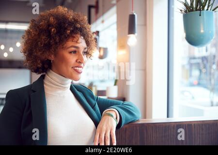 Head And Shoulders Portrait Of Businesswoman  Working In Modern Office Stock Photo