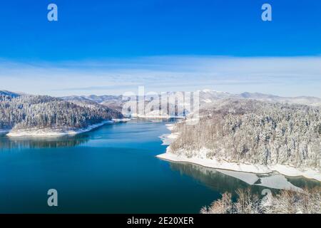 Beautiful showy winter landscape in Croatia. Panorama of Lokvarsko lake and in Gorski kotar from drone. Stock Photo