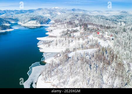 Beautiful showy winter landscape in Croatia. Panorama of Lokvarsko lake and in Gorski kotar from drone. Stock Photo