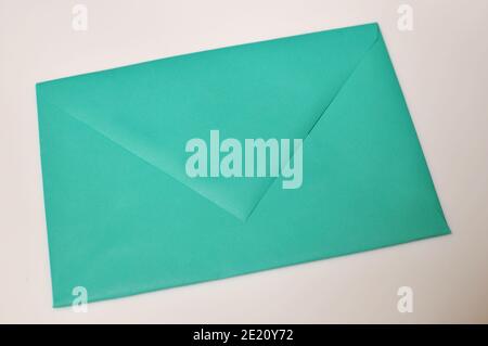 Green closed envelope on white background Stock Photo