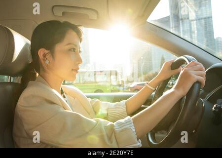 Confident young women to drive Stock Photo