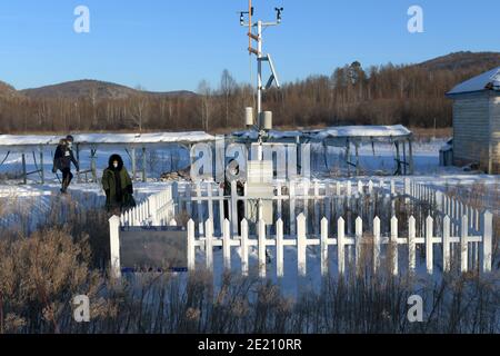 Dahinggan. 10th Jan, 2021. Staff members of local meteorological bureau maintain the facilities at an observatory in Huzhong District at the northern foot of the Dahinggan Mountains in northeast China's Heilongjiang Province, Jan. 10, 2021. Huzhong District is known as 'China's coldest town,' and the lowest temperature in the district dropped below minus 40 degrees Celsius in recent days. Credit: Wang Jianwei/Xinhua/Alamy Live News Stock Photo