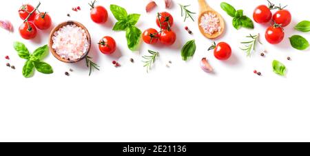 Fresh tomatoes, basil, sea salt and spices banner isolated on white background. Healthy food and vegan raw eating concept, creative flat lay. Stock Photo