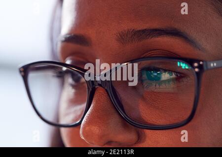 Close Up Of Businesswoman Wearing Glasses Looking At Computer Screen Stock Photo