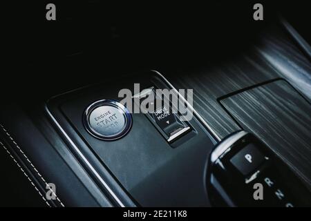 Closeup of modern new start-stop engine car button Stock Photo