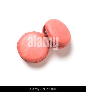 Raspberry flavor macarons top view isolated on white background Stock Photo