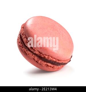 Raspberry flavor macaron isolated on white background. Closeup of traditional French almond pastry. Stock Photo