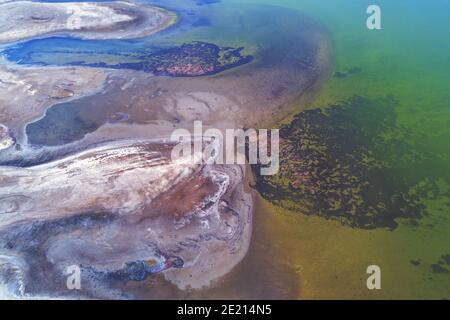 Abstract lines on salt lake. Aerial view. Lakeshore, abstract nature background Stock Photo