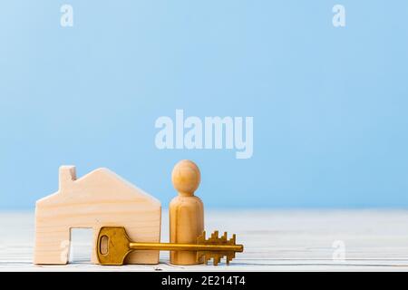 Wooden toy house and house keys close up Stock Photo