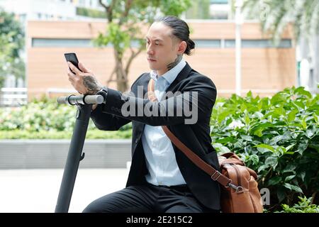 Entrepreneur checking text messages Stock Photo