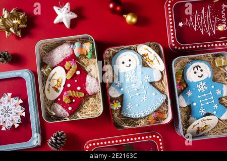 Overhead shot of decorative Christmas cookies in tin cans Stock Photo