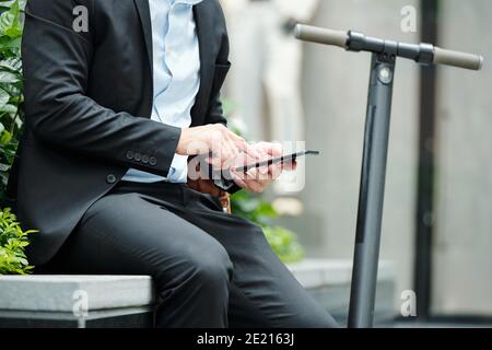 Businessman answering text messages Stock Photo