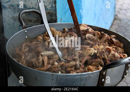 Typical meat dish for sale at the Otavalo market in Ecuador Stock Photo