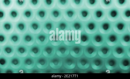 Blurred green metal background with black holes Stock Photo