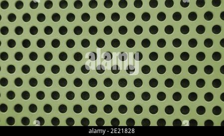 Yellow metal background with black holes Stock Photo