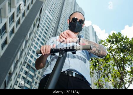Man checking notification on smartwatch Stock Photo