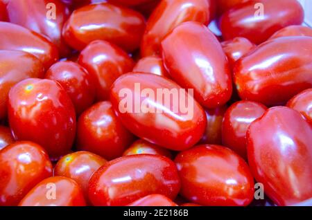 Close up view of a pile of fresh, juicy and healthy baby plumb tomatoes. Stock Photo