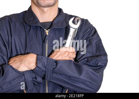 Car repairman wearing a dark blue uniform standing and holding a wrench that is an essential tool for a mechanic isolated on white background, Automot Stock Photo