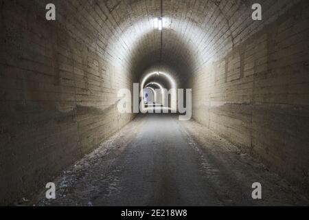 train abandoned tunnel illuminated in Olvera Stock Photo