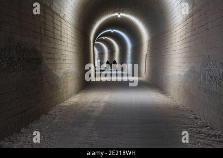 train abandoned tunnel illuminated in Olvera Stock Photo