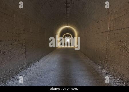 train abandoned tunnel illuminated in Olvera Stock Photo