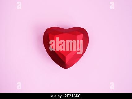 Red ring box in modern low poly style on pink Stock Photo