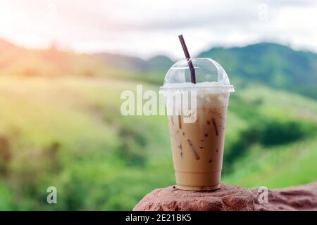 https://l450v.alamy.com/450v/2e21bk5/closeup-ice-coffee-in-plastic-cup-with-beautiful-mountain-background-2e21bk5.jpg