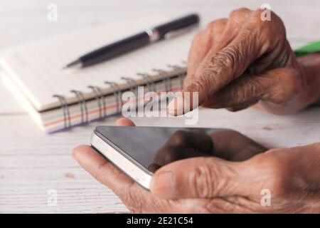 senior women hand using smart phone close up  Stock Photo