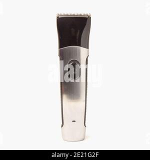 Electric cordless shaver haircutting beard trimmer isolated with attachement on white background Stock Photo