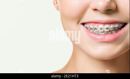 Close-up portrait of young cheerful readhead woman in summer wear makes selfie on smartphone, over pink background Stock Photo