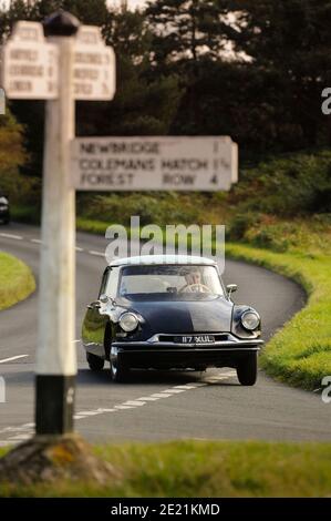A Citroen DS being driven on Sussex country lanes UK Stock Photo