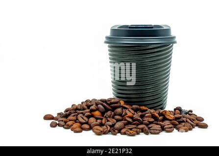 Beautiful modern design takeaway coffee cup with coffee beans, black hot cup with spiral texture and black cap. Image on white background. Blank space Stock Photo