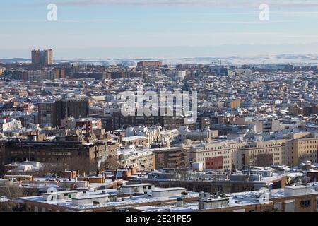 Madrid, Spain - January 10, 2021: Aerial view of Madrid, towards the Vallecas area, covered with snow, on a snowy day, due to the Filomena polar cold Stock Photo