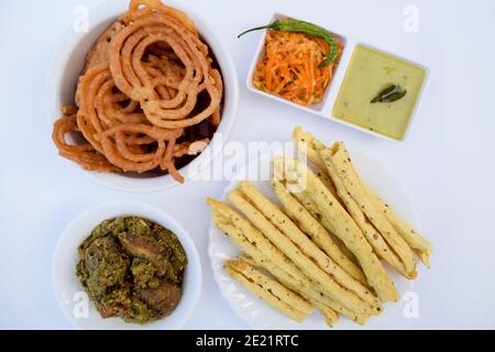 Gujarati famous authentic cuisine of Fafda, jalebi, kadhi ki chutney, grated raw papaya and green chily Stock Photo