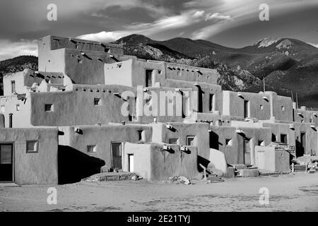 Old houses under the sunlight and a cloudy sky in Taos Pueblo, New Mexico Stock Photo