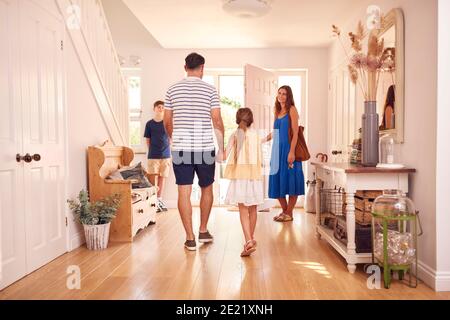 Family Leaving After Looking Around New Home Before They Move In Stock Photo