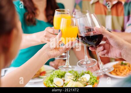 Mature friends clinking glasses Stock Photo