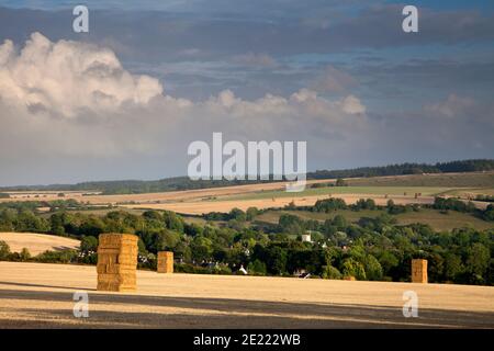 Stacks of straw bales near the village of Barford St. Martin in the Nadder Valley, Wiltshire. Stock Photo