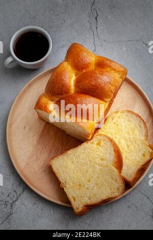 Brioche is a bread of French origin that is similar to a highly enriched pastry, and whose high egg and butter content gives it a rich and tender crum Stock Photo