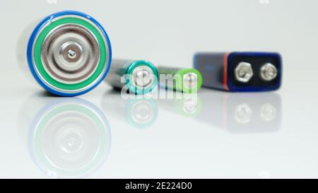 Battery type D or C, PP3, AA, AAA on a white background with reflection. View of metal alkaline batteries with copy space. Mandatory processing Stock Photo