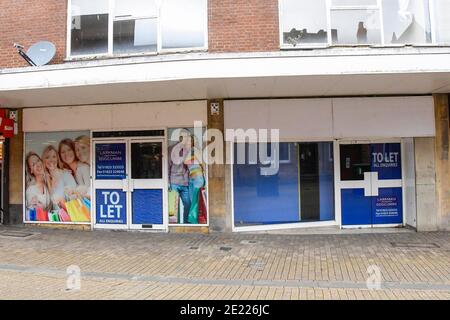 Yeovil, Somerset, UK.  11th January 2020.  Closed and empty shops in the town centre at Yeovil in Somerset during the Covid-19 lockdown. Picture Credit: Graham Hunt/Alamy Live News Stock Photo