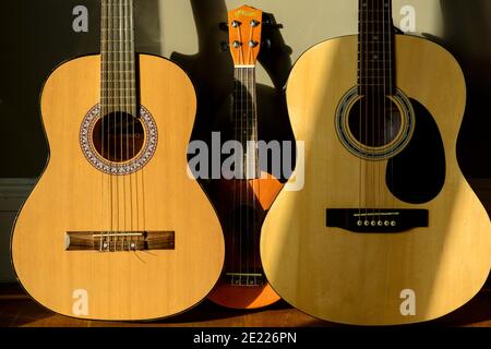 Acoustic guitars and ukulele Stock Photo