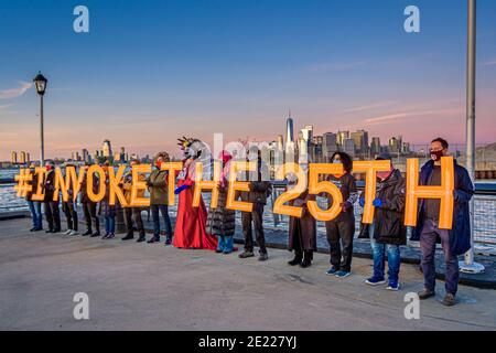 USA. 10th Jan, 2021. A group of activists holding letters spelling #InvokeThe25th in Red Hook, Brooklyn. In support of calls to remove Trump from power by impeachment or by invoking the 25th amendment, activists displayed art pieces around New York City on January 9, 2021. (Photo by Erik McGregor/Sipa USA) Credit: Sipa USA/Alamy Live News Stock Photo