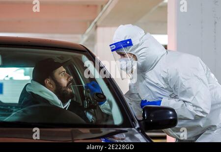 Cologne, North Rhine-Westphalia, Germany - Covid rapid test in a parking garage, at the Medicare testing center, customers drive up in their cars at t Stock Photo
